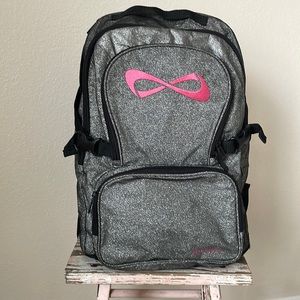 Nfinity full size back pack, glitter with pink logo.